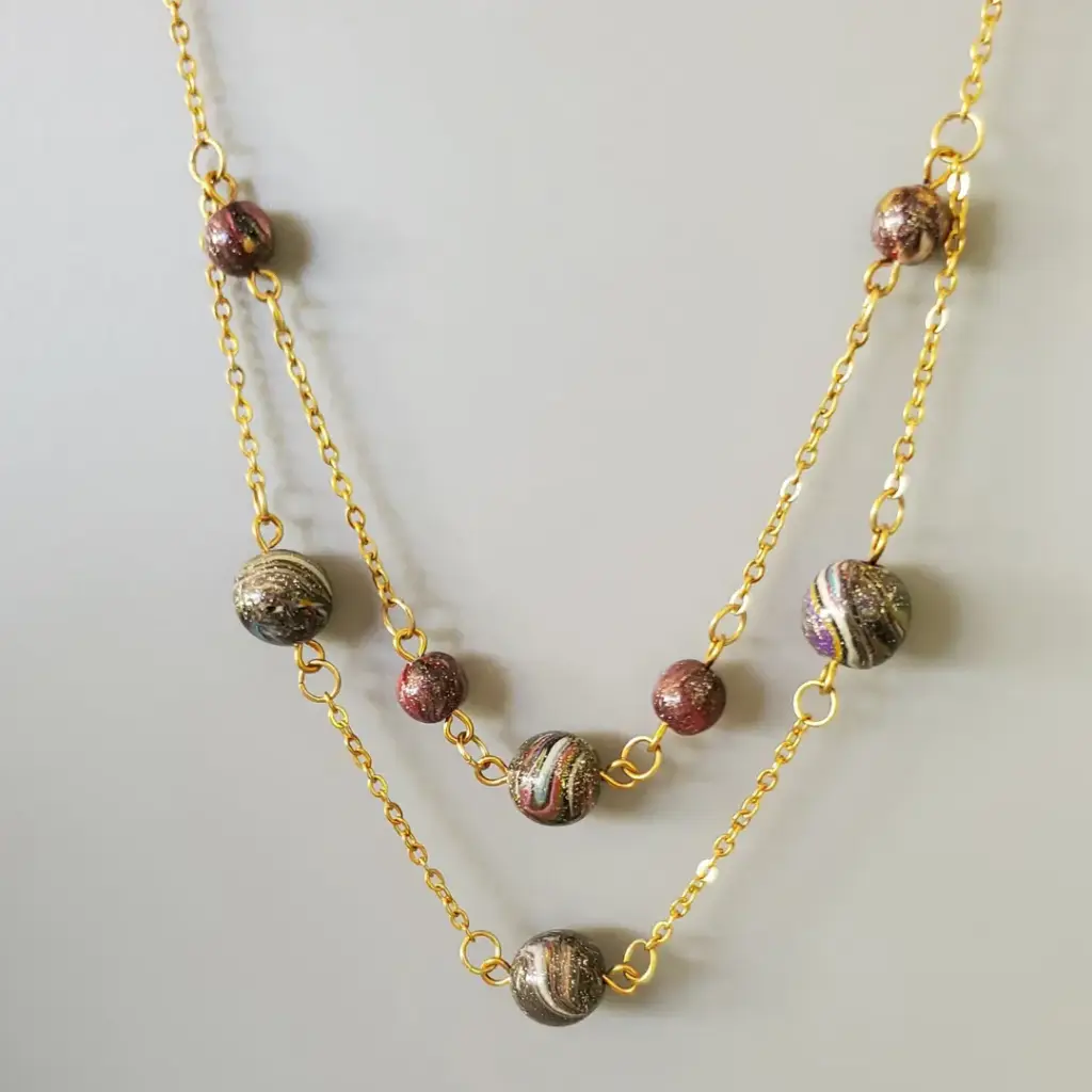 [COL00022] Collier double rang en perles noires et doré